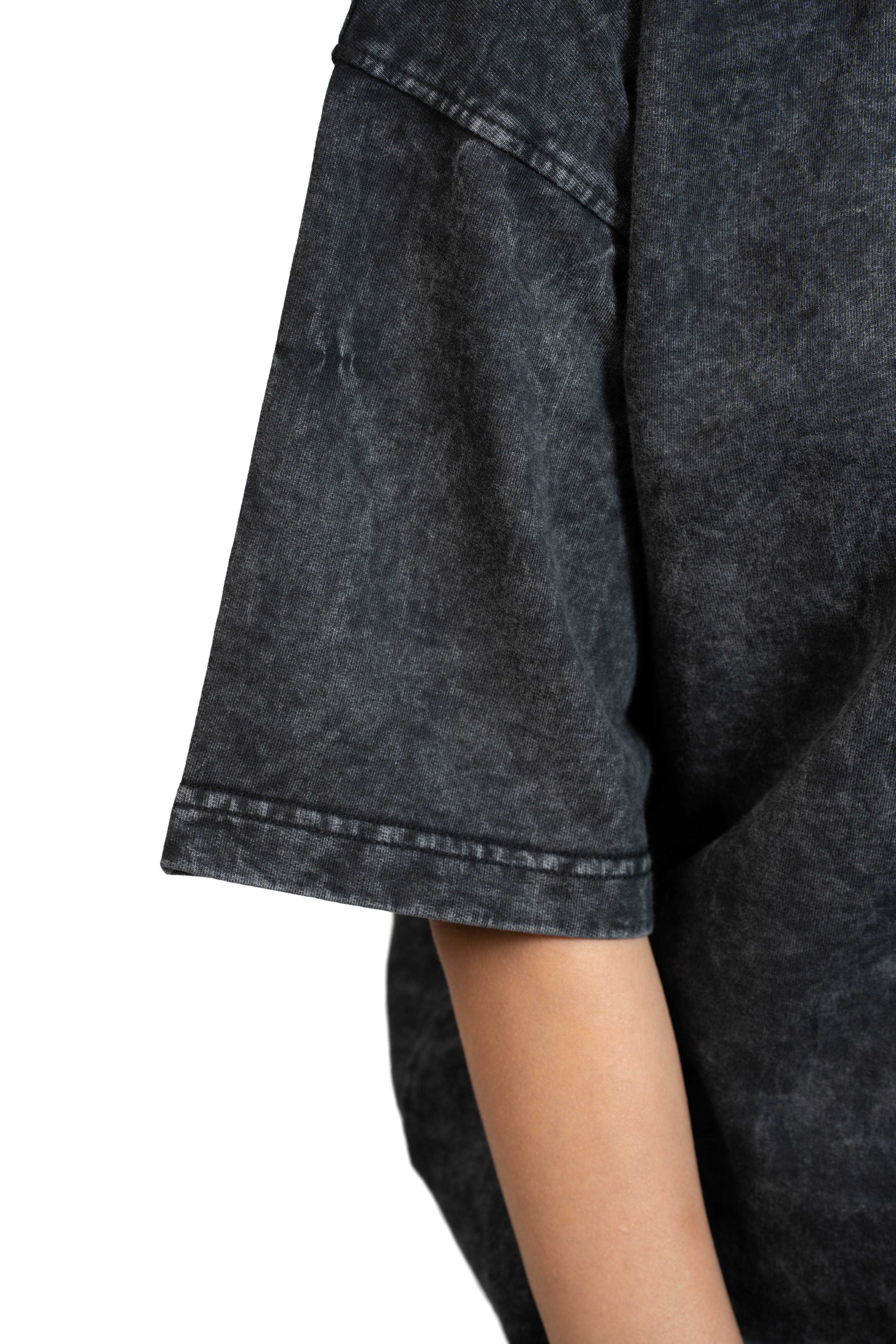 Close-up of a dark washed denim look shirt sleeve with a white background