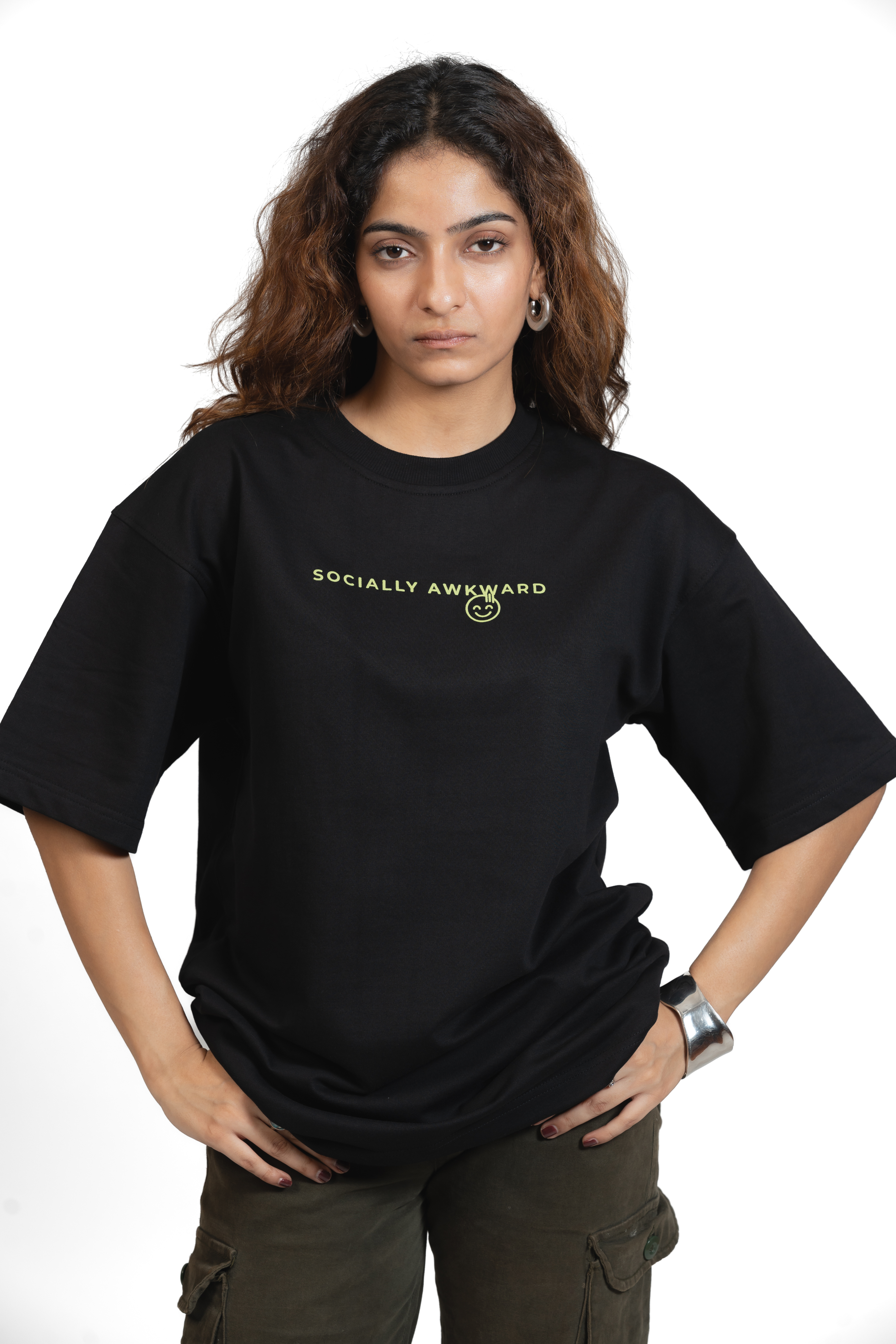 Woman wearing a black t-shirt with 'SOCIALLY AWKWARD' text in yellow on a white background